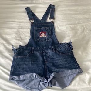 Y2K has overalls with hand embroidered mushrooms
